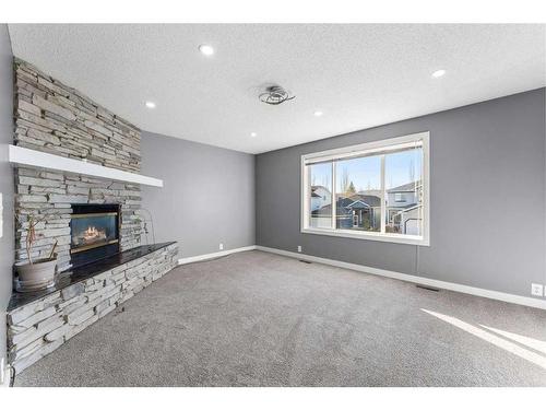 52 Shawbrooke Manor Sw, Calgary, AB - Indoor Photo Showing Living Room With Fireplace