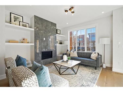 226 33 Avenue Ne, Calgary, AB - Indoor Photo Showing Living Room With Fireplace