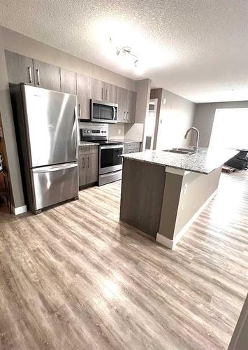 1416-4641 128 Avenue Ne, Calgary, AB - Indoor Photo Showing Kitchen With Stainless Steel Kitchen