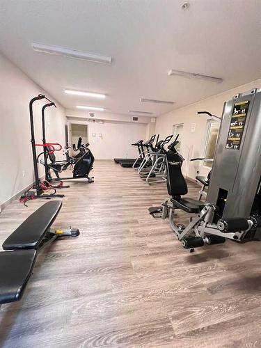 1416-4641 128 Avenue Ne, Calgary, AB - Indoor Photo Showing Gym Room