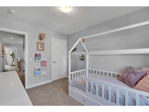 74 Magnolia Square Se, Calgary, AB - Indoor Photo Showing Bedroom