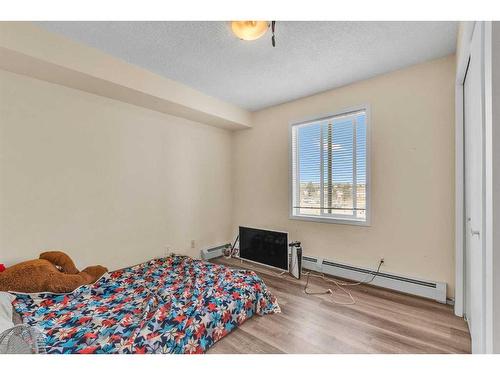 415-1000 Somervale Court Sw, Calgary, AB - Indoor Photo Showing Bedroom