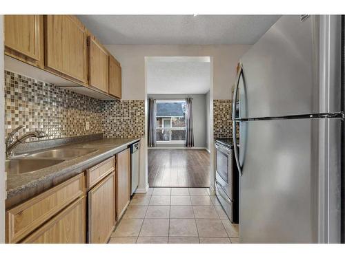 85-6915 Ranchview Drive Nw, Calgary, AB - Indoor Photo Showing Kitchen With Stainless Steel Kitchen With Double Sink