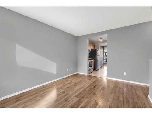 85-6915 Ranchview Drive Nw, Calgary, AB - Indoor Photo Showing Other Room With Fireplace