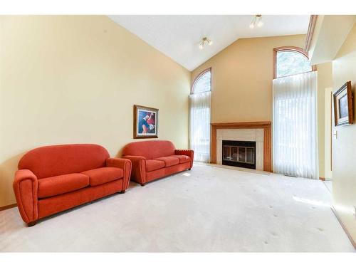 106 Oakbriar Close Sw, Calgary, AB - Indoor Photo Showing Living Room With Fireplace