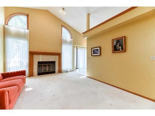 106 Oakbriar Close Sw, Calgary, AB - Indoor Photo Showing Living Room With Fireplace