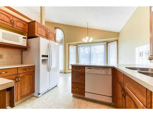 106 Oakbriar Close Sw, Calgary, AB - Indoor Photo Showing Kitchen With Double Sink