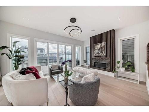 926 33A Street Nw, Calgary, AB - Indoor Photo Showing Living Room With Fireplace