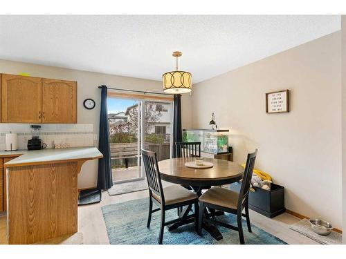 228 Quigley Close, Cochrane, AB - Indoor Photo Showing Dining Room