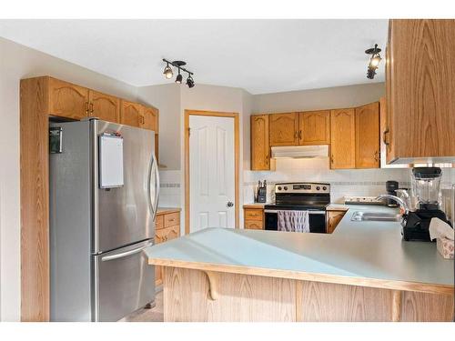 228 Quigley Close, Cochrane, AB - Indoor Photo Showing Kitchen With Double Sink