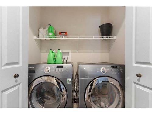 228 Quigley Close, Cochrane, AB - Indoor Photo Showing Laundry Room