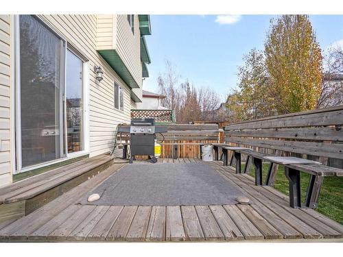 228 Quigley Close, Cochrane, AB - Outdoor With Deck Patio Veranda With Exterior