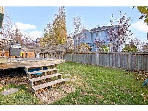 228 Quigley Close, Cochrane, AB - Outdoor With Deck Patio Veranda With Backyard