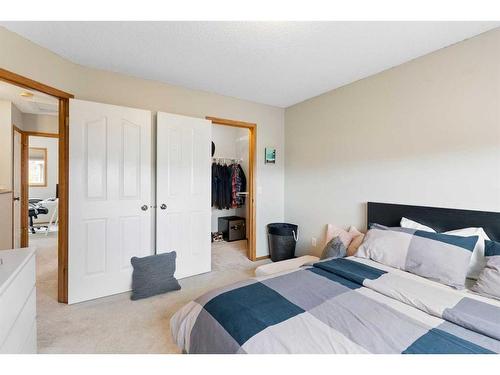 228 Quigley Close, Cochrane, AB - Indoor Photo Showing Bedroom