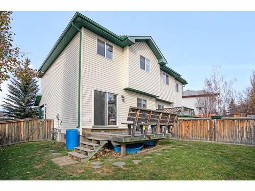 228 Quigley Close, Cochrane, AB - Outdoor With Deck Patio Veranda With Exterior