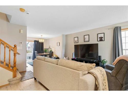 228 Quigley Close, Cochrane, AB - Indoor Photo Showing Living Room