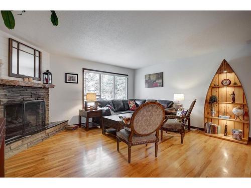 10632 Brackenridge Road Sw, Calgary, AB - Indoor Photo Showing Living Room With Fireplace