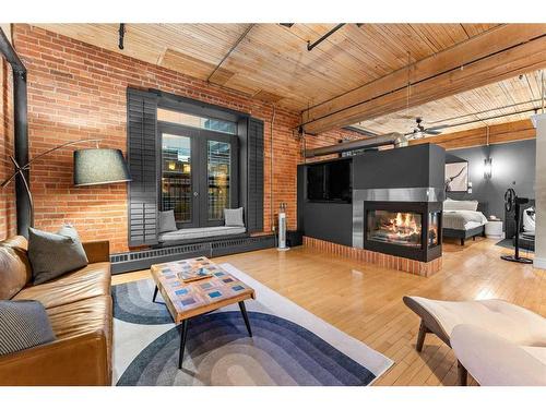 305-535 10 Avenue Sw, Calgary, AB - Indoor Photo Showing Living Room With Fireplace