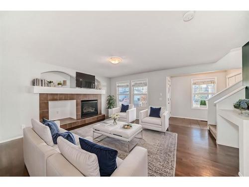 34 Sunset Heights, Cochrane, AB - Indoor Photo Showing Living Room With Fireplace