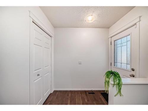 34 Sunset Heights, Cochrane, AB - Indoor Photo Showing Other Room