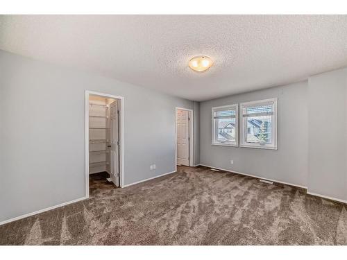 34 Sunset Heights, Cochrane, AB - Indoor Photo Showing Other Room