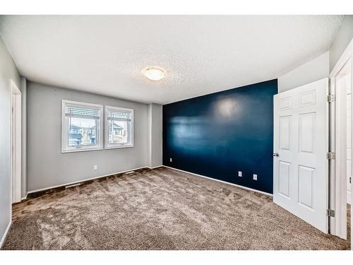 34 Sunset Heights, Cochrane, AB - Indoor Photo Showing Other Room