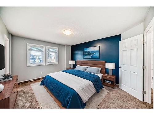 34 Sunset Heights, Cochrane, AB - Indoor Photo Showing Bedroom