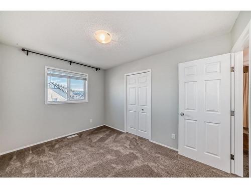 34 Sunset Heights, Cochrane, AB - Indoor Photo Showing Other Room