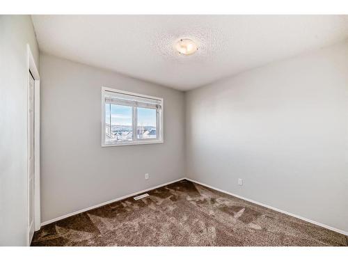 34 Sunset Heights, Cochrane, AB - Indoor Photo Showing Other Room