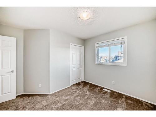 34 Sunset Heights, Cochrane, AB - Indoor Photo Showing Other Room