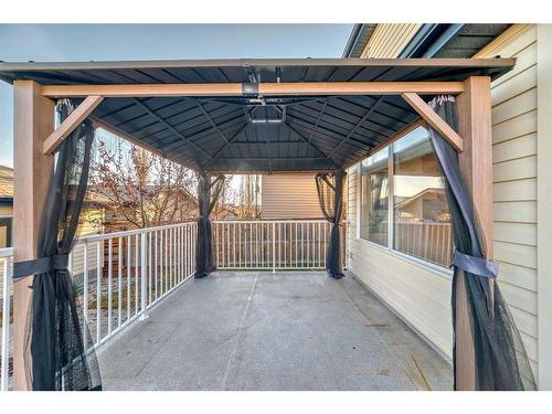 34 Sunset Heights, Cochrane, AB - Outdoor With Deck Patio Veranda With Exterior