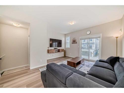 534 Copperstone Manor Se, Calgary, AB - Indoor Photo Showing Living Room