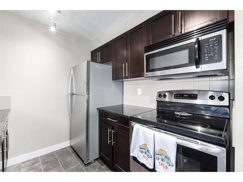 2410-625 Glenbow Drive, Cochrane, AB - Indoor Photo Showing Kitchen With Stainless Steel Kitchen