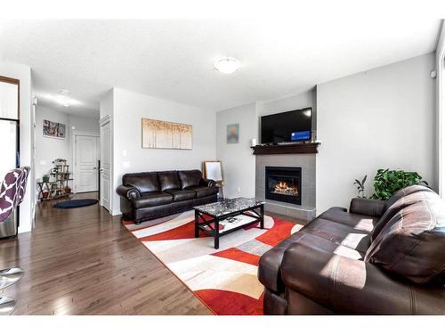 21 Redstone Road Ne, Calgary, AB - Indoor Photo Showing Living Room With Fireplace