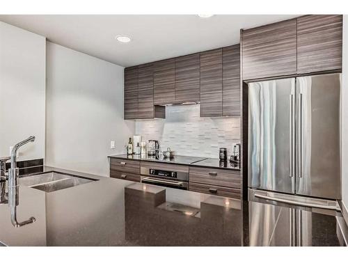 506-1500 7 Street Sw, Calgary, AB - Indoor Photo Showing Kitchen With Stainless Steel Kitchen With Double Sink With Upgraded Kitchen