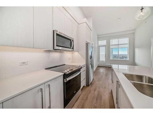 1503-395 Skyview Parkway Ne, Calgary, AB - Indoor Photo Showing Kitchen With Stainless Steel Kitchen With Double Sink With Upgraded Kitchen