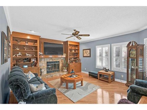 248 Canterbury Court Sw, Calgary, AB - Indoor Photo Showing Living Room With Fireplace