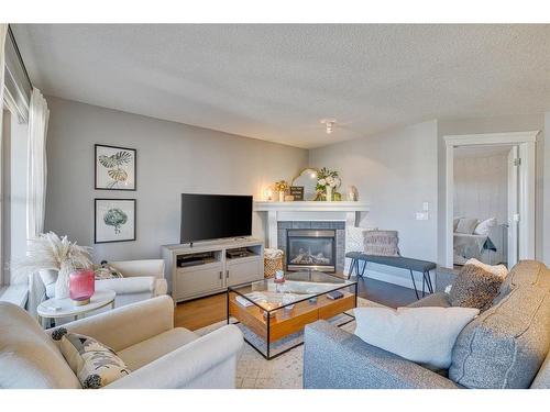 404-3704 15A Street Sw, Calgary, AB - Indoor Photo Showing Living Room With Fireplace