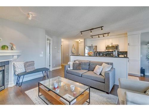 404-3704 15A Street Sw, Calgary, AB - Indoor Photo Showing Living Room With Fireplace