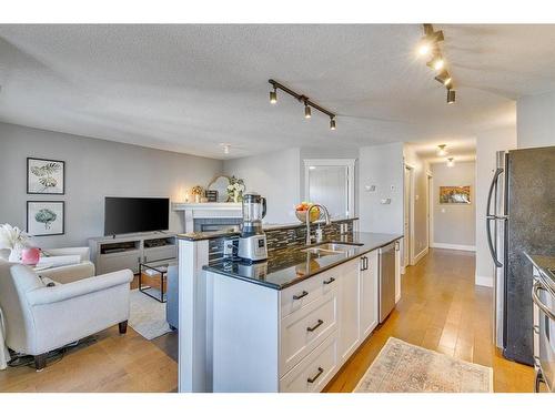 404-3704 15A Street Sw, Calgary, AB - Indoor Photo Showing Kitchen With Double Sink