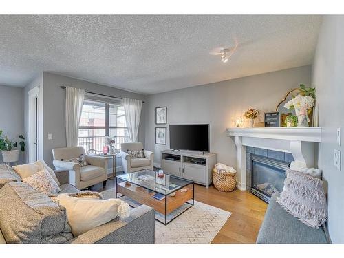 404-3704 15A Street Sw, Calgary, AB - Indoor Photo Showing Living Room With Fireplace