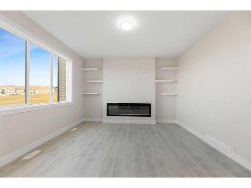 494 Clydesdale Way, Cochrane, AB - Indoor With Fireplace