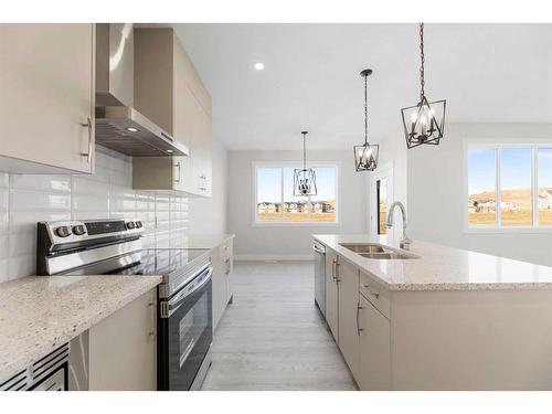 494 Clydesdale Way, Cochrane, AB - Indoor Photo Showing Kitchen With Double Sink With Upgraded Kitchen