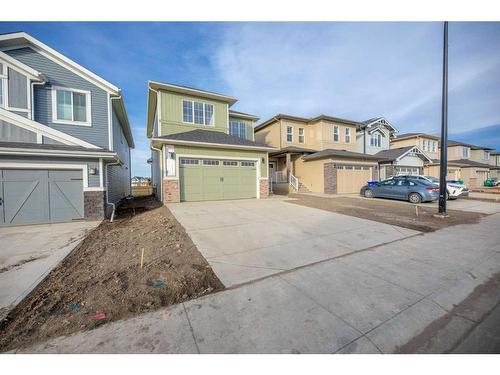 494 Clydesdale Way, Cochrane, AB - Outdoor With Facade