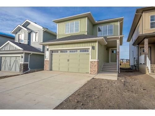 494 Clydesdale Way, Cochrane, AB - Outdoor With Facade