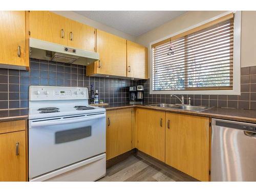 34-3015 51 Street Sw, Calgary, AB - Indoor Photo Showing Kitchen With Double Sink