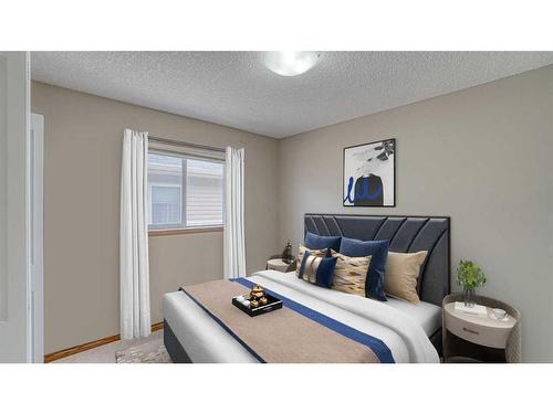 83 Sunset Circle, Cochrane, AB - Indoor Photo Showing Bedroom