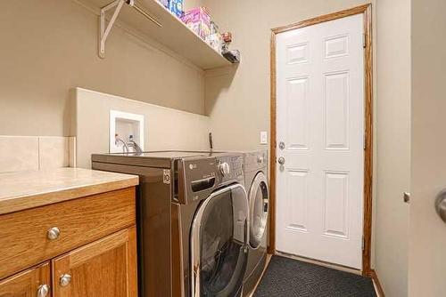 83 Sunset Circle, Cochrane, AB - Indoor Photo Showing Laundry Room