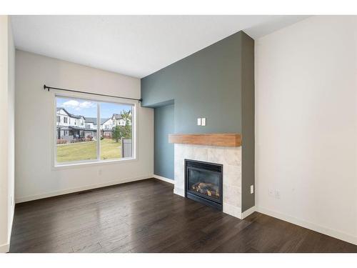 118 Copperpond Landing Se, Calgary, AB - Indoor Photo Showing Living Room With Fireplace