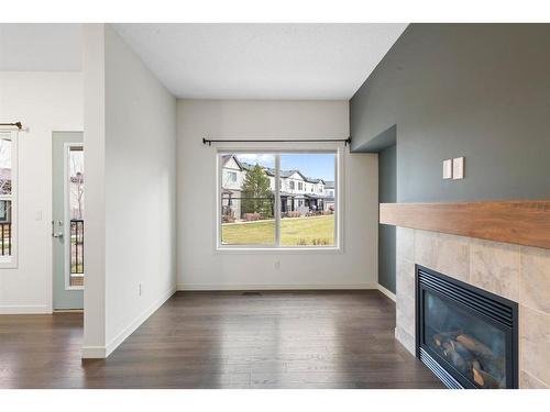 118 Copperpond Landing Se, Calgary, AB - Indoor Photo Showing Living Room With Fireplace